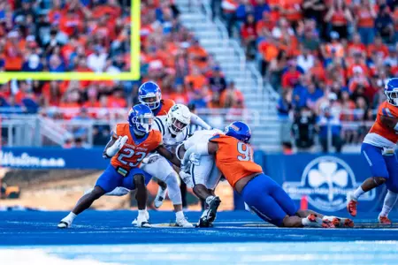 Ahmed Hassanein makes a tackle as No. 21 Boise State defeated Utah State 62-30 in the conference opener at Albertsons Stadium on Oct. 5, 2024. (Photo by Kenna Harbison).