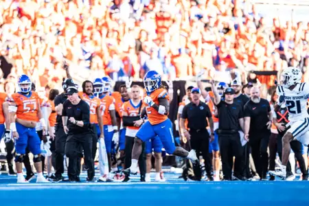 Ashton Jeanty rushes down the sideline as No. 21 Boise State defeated Utah State 62-30 in the conference opener at Albertsons Stadium on Oct. 5, 2024. (Photo by Kenna Harbison).