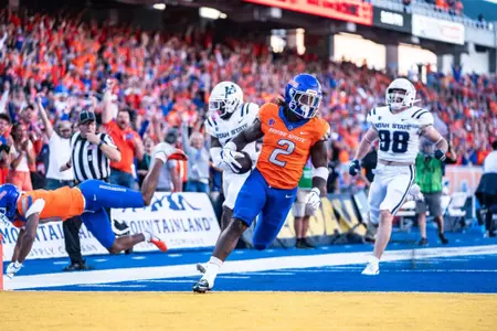 Ashton Jeanty scores a touchdown as No. 21 Boise State defeated Utah State 62-30 in the conference opener at Albertsons Stadium on Oct. 5, 2024. (Photo by Kenna Harbison).