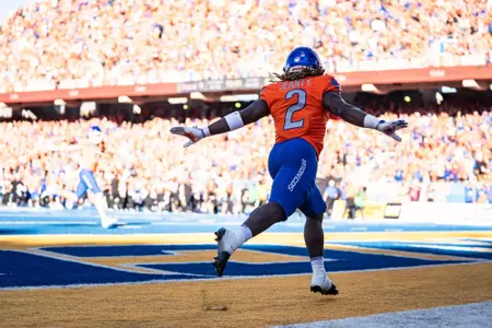 Ashton Jeanty celebrates following a touchdown run as No. 21 Boise State defeated Utah State 62-30 in the conference opener at Albertsons Stadium on Oct. 5, 2024. (Photo by Kenna Harbison).