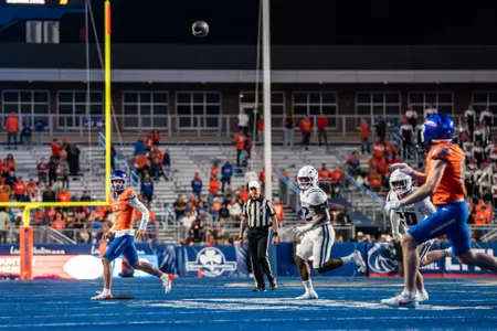 Malachi Nelson throws a ball to Austin Bolt as No. 21 Boise State defeated Utah State 62-30 in the conference opener at Albertsons Stadium on Oct. 5, 2024. (Photo by Kenna Harbison).