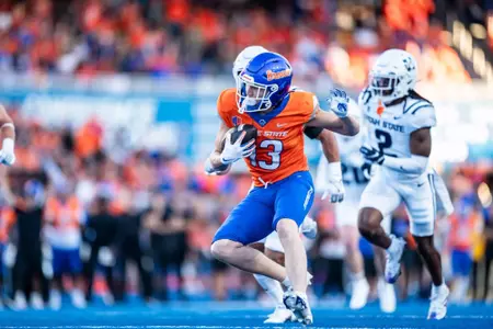 Chase Penry looks for yards after a catch as No. 21 Boise State defeated Utah State 62-30 in the conference opener at Albertsons Stadium on Oct. 5, 2024. (Photo by Kenna Harbison).