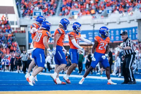 Boise State football celebrates Dylan Riley's kickoff return for a touchdown as No. 21 Boise State defeated Utah State 62-30 in the conference opener at Albertsons Stadium on Oct. 5, 2024. (Photo by Kenna Harbison).