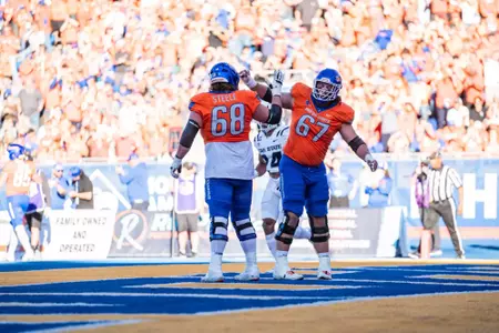 Jake Steele (left) and Jason Steele (right) celebrate in the end zone as No. 21 Boise State defeated Utah State 62-30 in the conference opener at Albertsons Stadium on Oct. 5, 2024. (Photo by Kenna Harbison).