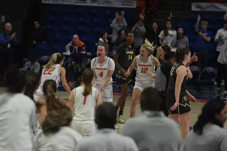 Boise State women's basketball celebrates the victory over Colorado