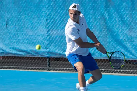 Idriss Haddouch uses his backhand to return a volley during the match versus Purdue in spring 2024.