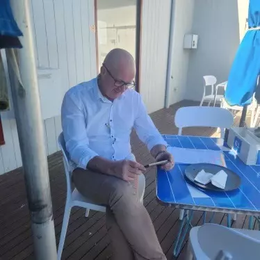 Milly Sharp's dad watching her game on his phone from Australia