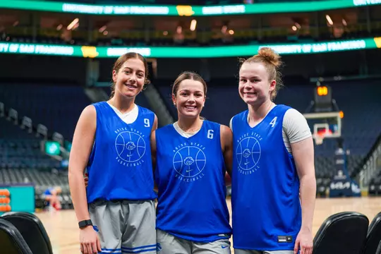 Libby Hutton, Milly Sharp, and Dani Bayes at shootaround at Chase Center