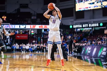 Cardenas attempts three-point jump shot against Washington State