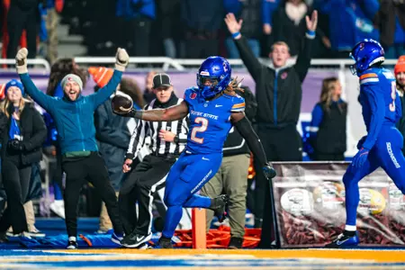 Ashton Jeanty flipping the ball after scoring a touchdown in the MW Championship