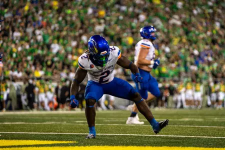 Ashton Jeanty pumping his fist in celebration after scoring a touchdown at Oregon