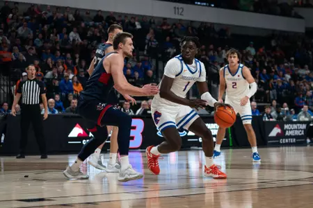O'Mar Stanley dribbles in paint against Saint Mary's