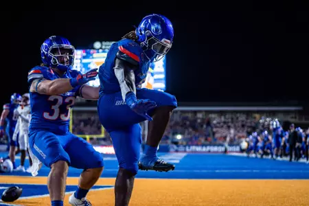 Ashton Jeanty strikes the Heisman pose after scoring a touchdown against Washington State