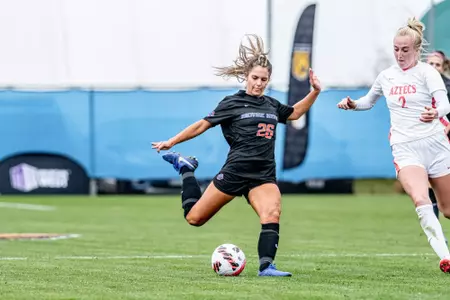 Morgan Padour about to kick the ball.