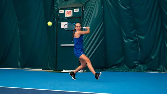Nicole Discenza striking the ball.