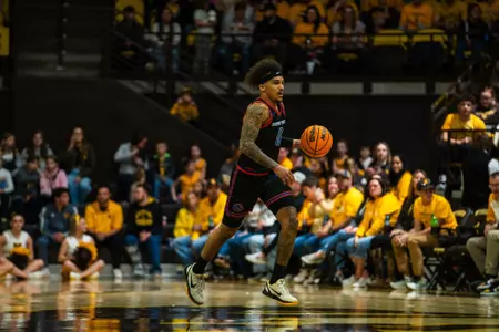 Roddie Anderson III bringing the ball up the court.
