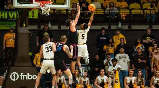 Tyson Degenhart going up to block a shot.