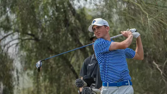 Cole Rueck tracks his tee shot at the Loyola Intercollegiate
