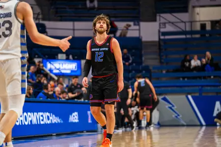 Max Rice walking on the court.