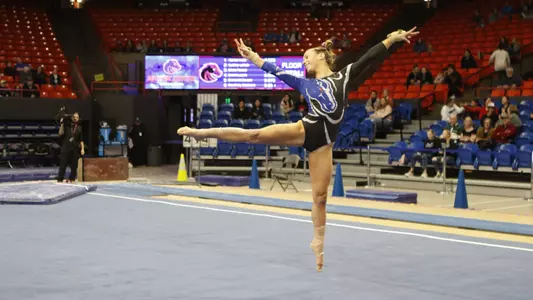 Anna Ferguson competing on floor.