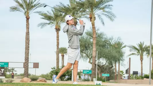 Gavyn Knight tracks his tee shot at the Loyola Intercollegiate
