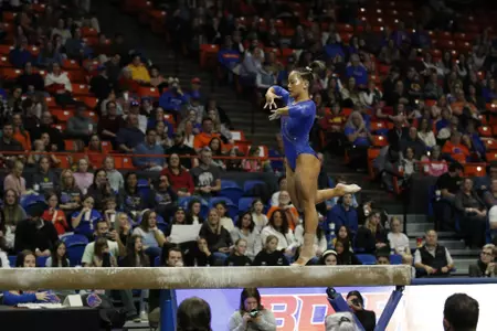 Emma Loyim competing on beam against Iowa State.