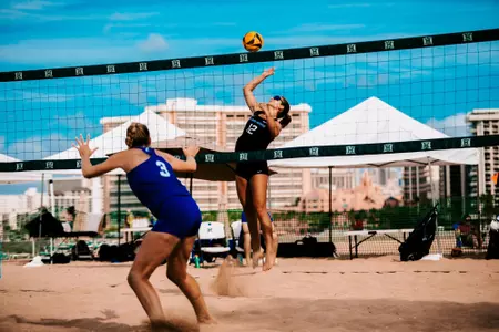 Addison Woldon goes up at the net for a shot.