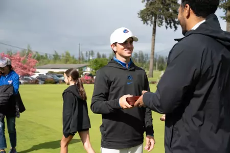 Cole Rueck is handed the medal for being named the Mountain West Champion