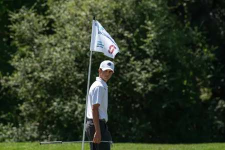 Cole Rueck walks on the green at the NCAA Stanford Regional