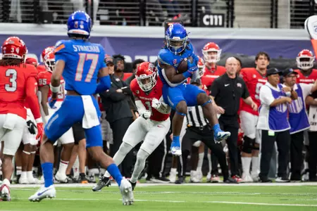 Football player catches pass