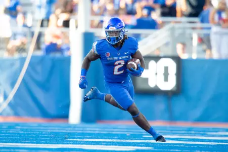 Football player running with ball