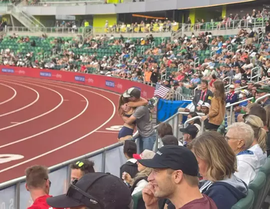 Marisa Howard and Pat McCurry embrace after Howard qualified for the 2024 Summer Games