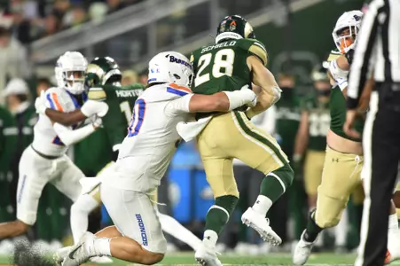 Braxton Fely, Boise State defensive tackle, makes a tackle at Colorado State in 2023.