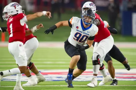 Boise State defensive tackle Braxton Fely rushes the quarterback at Fresno State.