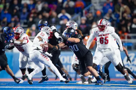 Boise State defensive tackle Braxton Fely makes a tackle against New Mexico in 2023.