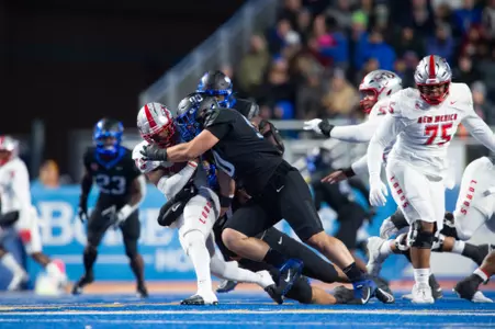 Boise State defensive tackle Braxton Fely makes a tackle against New Mexico in 2023.