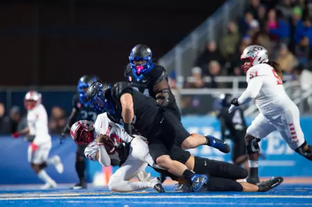 Boise State defensive tackle Braxton Fely makes a tackle against New Mexico in 2023.