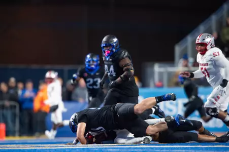 Boise State defensive tackle Braxton Fely makes a tackle against New Mexico in 2023.