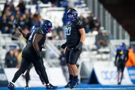Boise State defensive tackle Braxton Fely makes a tackle against New Mexico in 2023.