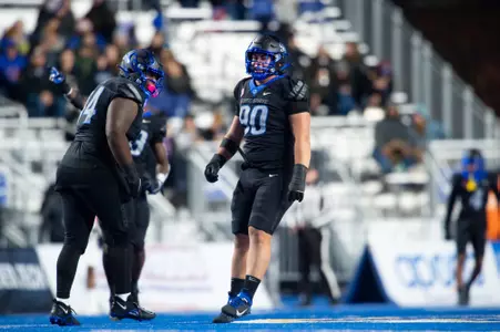 Boise State defensive tackle Braxton Fely makes a tackle against New Mexico in 2023.