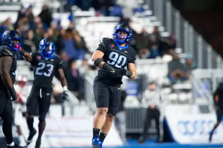 Boise State defensive tackle Braxton Fely makes a tackle against New Mexico in 2023.