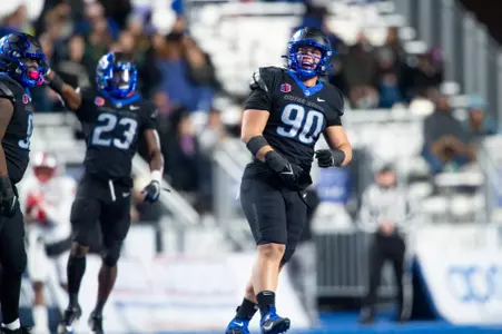 Boise State defensive tackle Braxton Fely makes a tackle against New Mexico in 2023.