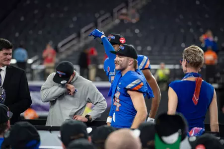 Alexander Teubner points to interim head coach Spencer Danielson following the MW Championship.
