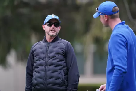 David Trainor talks to Ryan Meyer on the tee box during the Battle for Idaho