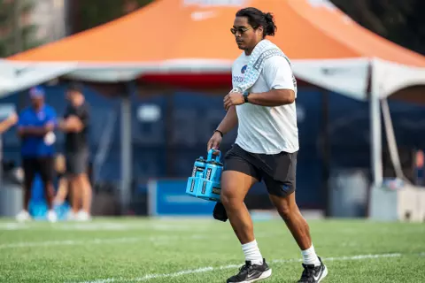 A look at some of the football support staff members working during a fall camp practice. Photo by Kenna Harbison