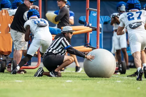A look at some of the football support staff members working during a fall camp practice. Photo by Kenna Harbison
