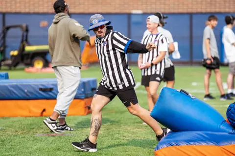 A look at some of the football support staff members working during a fall camp practice. Photo by Kenna Harbison