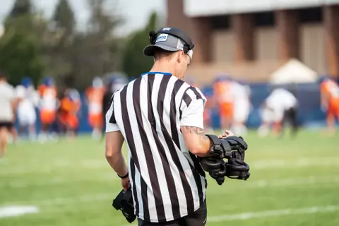 A look at some of the football support staff members working during a fall camp practice. Photo by Kenna Harbison