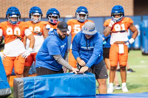 A look at some of the football support staff members working during a fall camp practice. Photo by Kenna Harbison