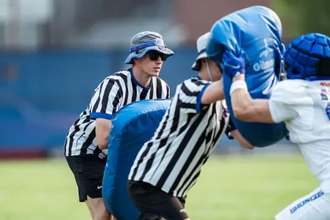 A look at some of the football support staff members working during a fall camp practice. Photo by Kenna Harbison